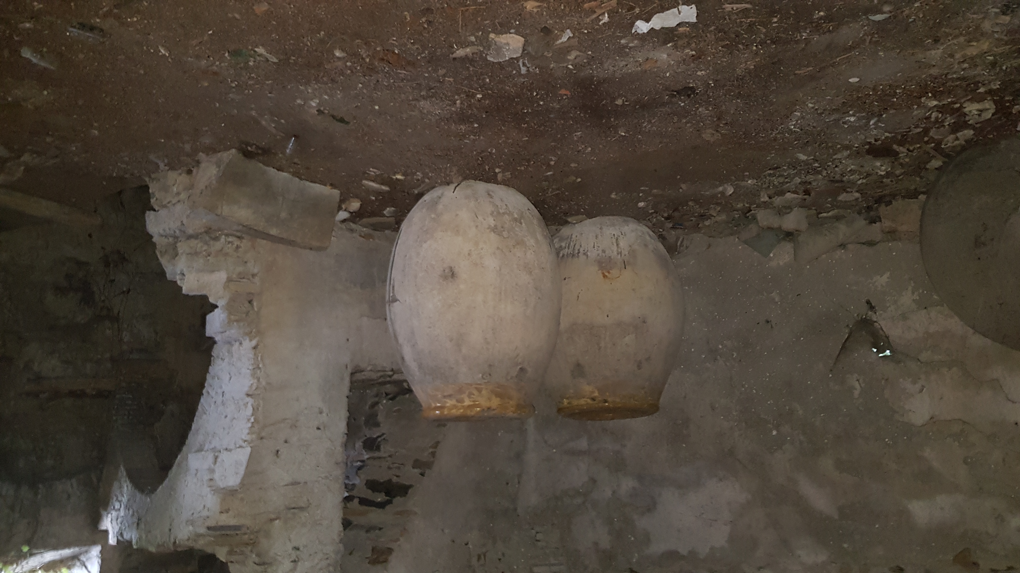 Terracotta jars in the mill cellar